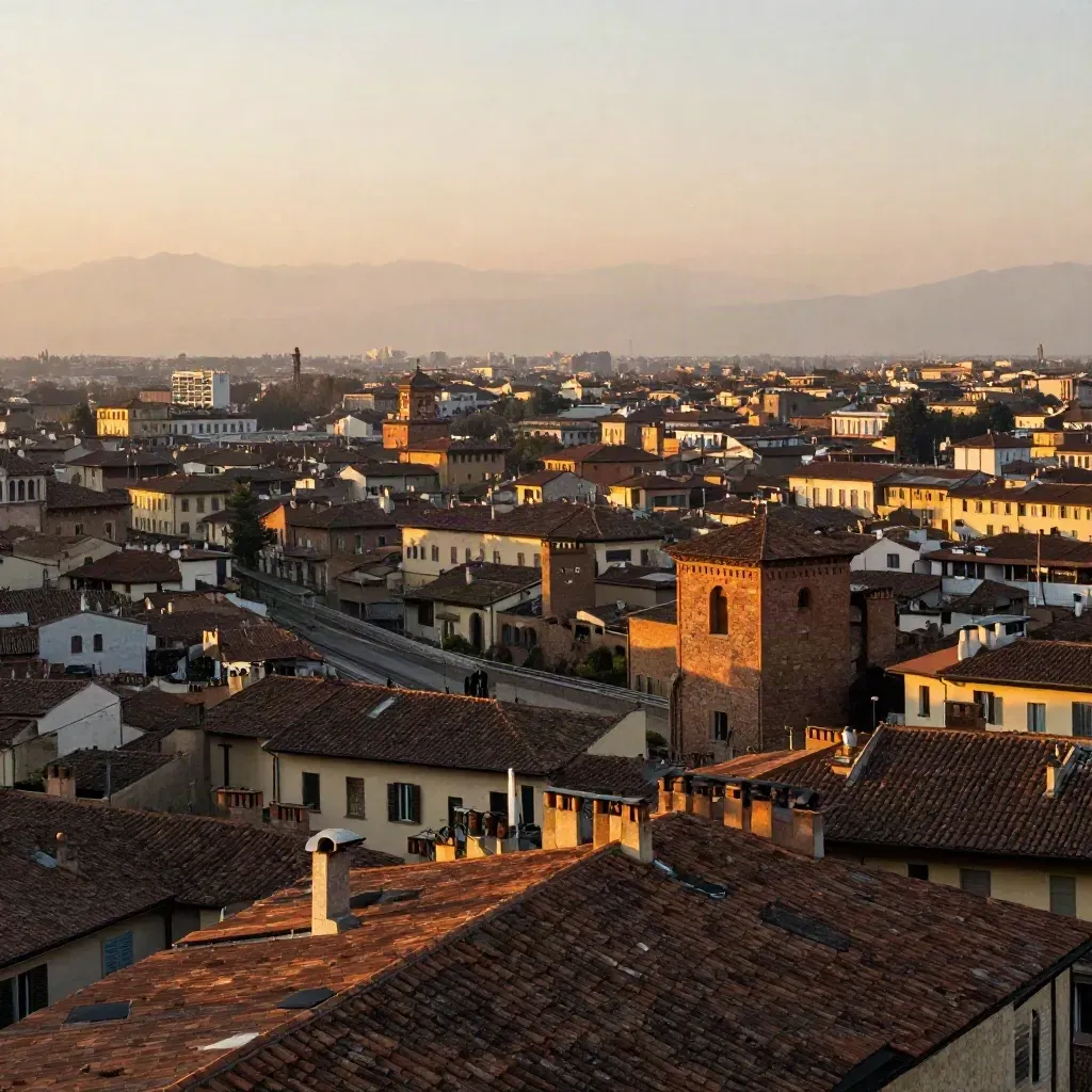 Panorama dorato di Milano con tetti che sfumano verso skyline europeo e profilo alpino.